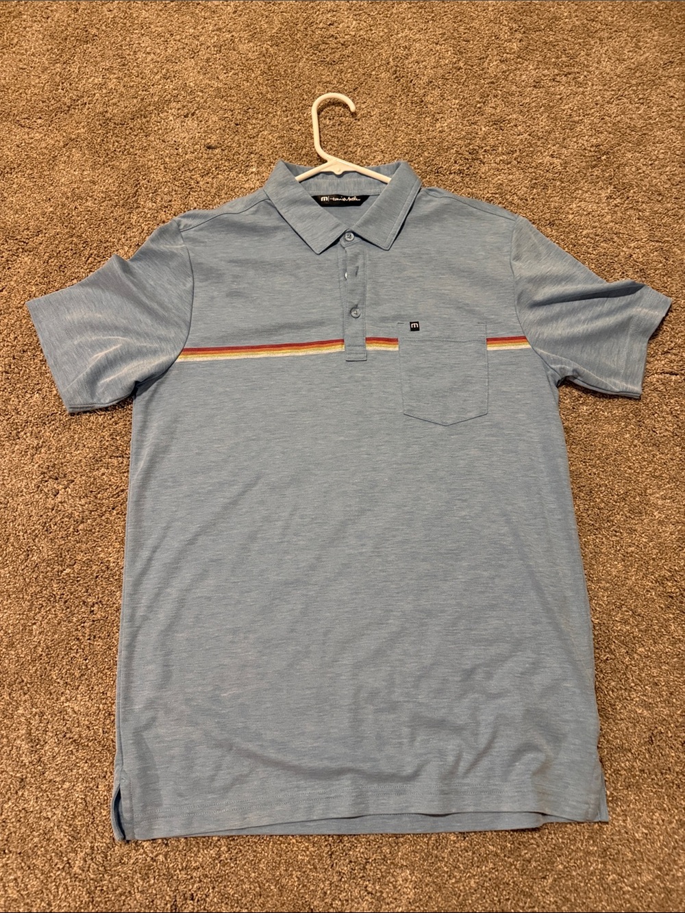 Travis Mathew Light Blue Polo with Rainbow Chest Stripe